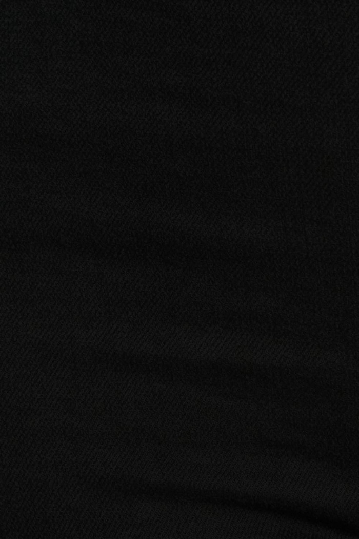 Jean jegging ajustado negro con tiro súper alto y bolsillos