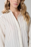 Blusa manga larga a rayas unicolor oversize con bolsillo