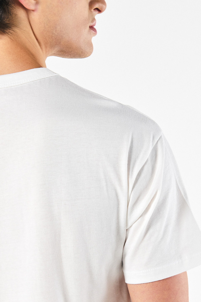 Camiseta unicolor con manga corta y hombro rodado