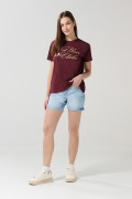 Short tiro medio azul en jean con desgastes localizados