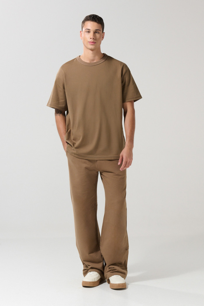 Camiseta unicolor cuello redondo oversize con hombro caído