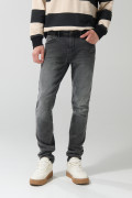 Jean skinny gris oscuro tiro bajo con ligeros desgastes