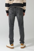 Jean skinny gris oscuro tiro bajo con ligeros desgastes