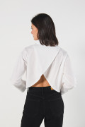 Blusa unicolor manga larga amplia con abertura en espalda