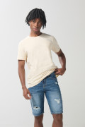 Bermuda en jean azul oscura slim con rotos y tiro bajo