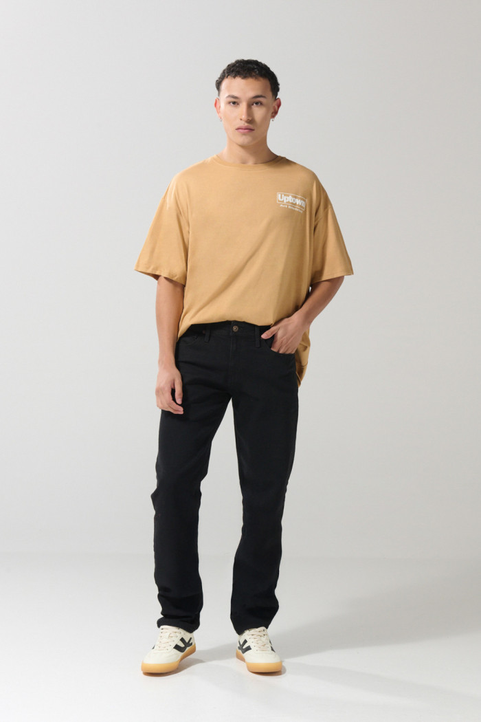 Jean slim ajustado negro con cremallera y tiro bajo
