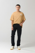 Jean slim ajustado negro con cremallera y tiro bajo