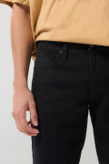 Jean slim ajustado negro con cremallera y tiro bajo