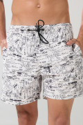 Bermuda crema playera con diseños negros y tiro bajo