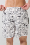 Bermuda crema playera con diseños negros y tiro bajo