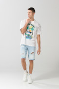 Bermuda tiro bajo en jean slim azul con y rotos en frente