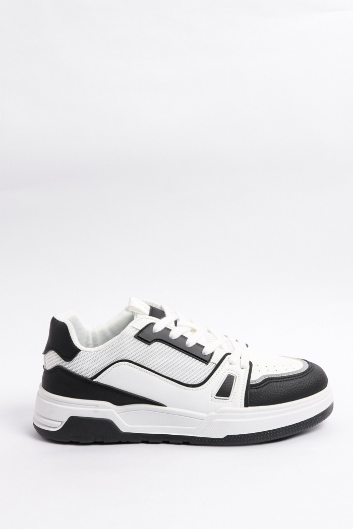 Tenis casuales unicolores con suelas planas y contrastes