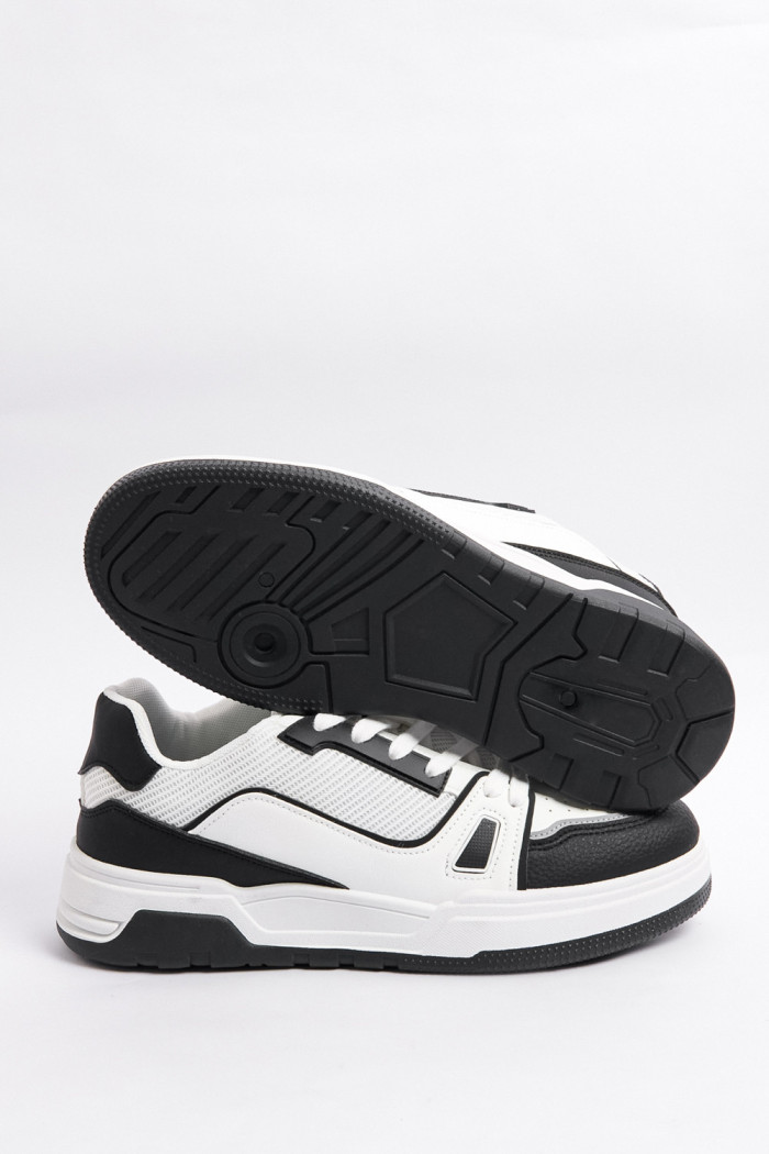 Tenis casuales unicolores con suelas planas y contrastes