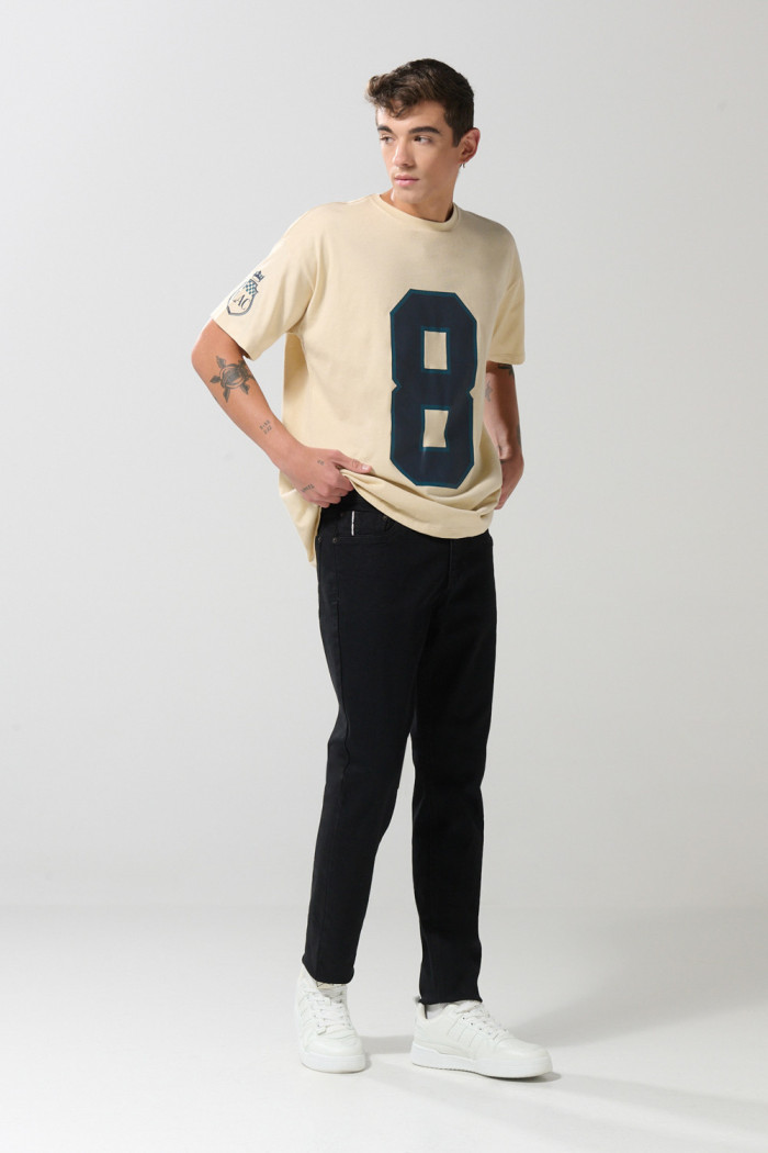 Jean skinny ajustado negro con cremallera y tiro bajo