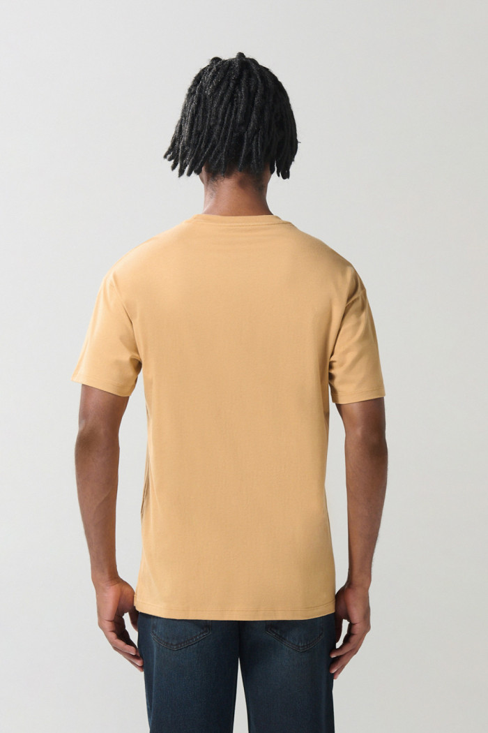Camiseta en algodón unicolor manga corta con texto delantero
