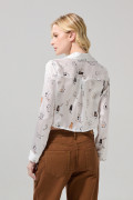 Blusa manga larga crema con diseños de gatitos