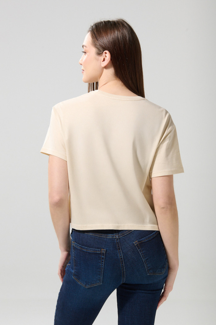 Camiseta crop top kaki clara con estampado de Coca-Cola