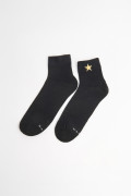 Medias unicolores cortas con diseño de estrella