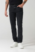 Jean slim gris oscuro tiro bajo con ligeros desgastes