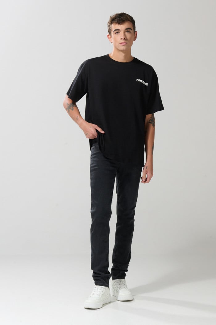 Jean slim gris oscuro tiro bajo con ligeros desgastes