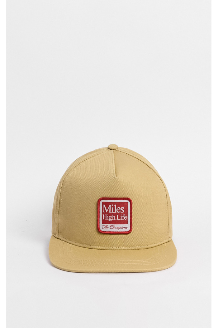 Gorra kaki con parche bordado de "miles hidh life of - the champions"