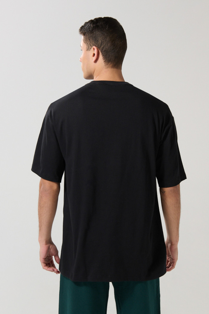 Camiseta hombro rodado unicolor en algodón con manga corta