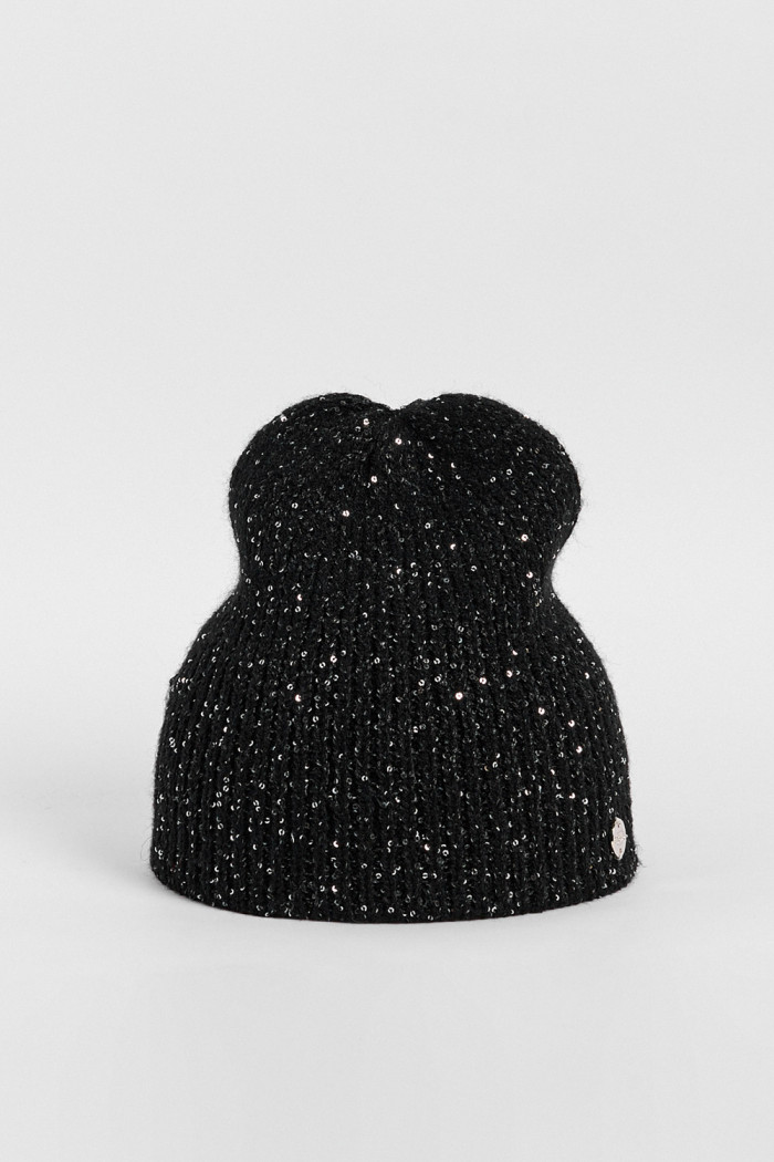 Gorro beanie trenzado en colores surtidos.