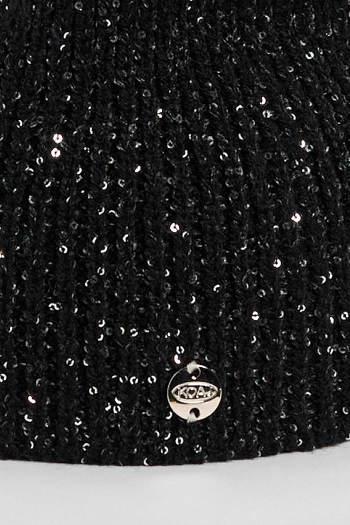 Gorro beanie trenzado en colores surtidos.