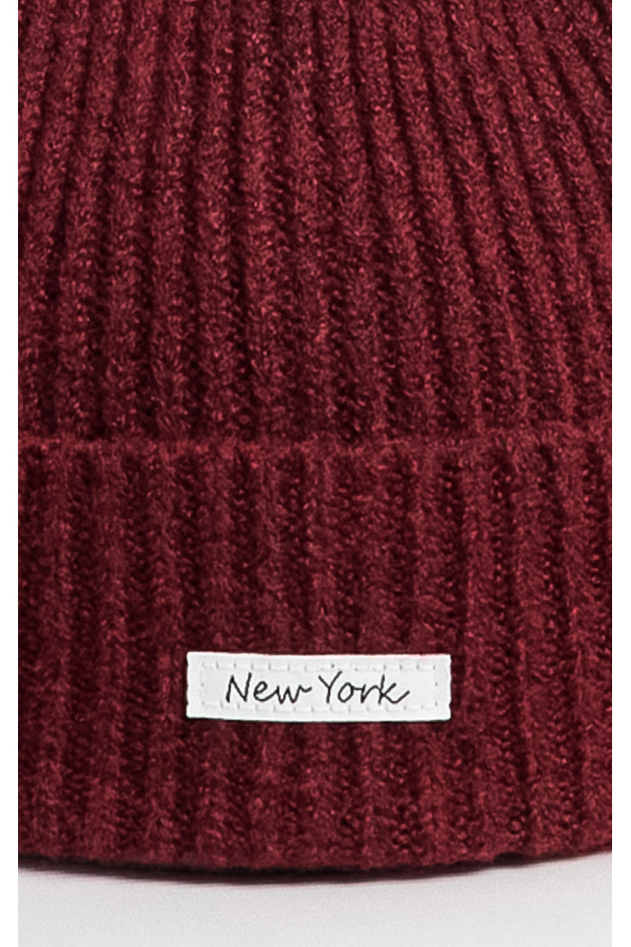 Gorro unicolor tejido con marquilla en frente