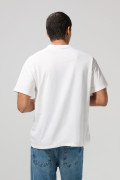 Camiseta crema oversize de Snoopy con cuello redondo