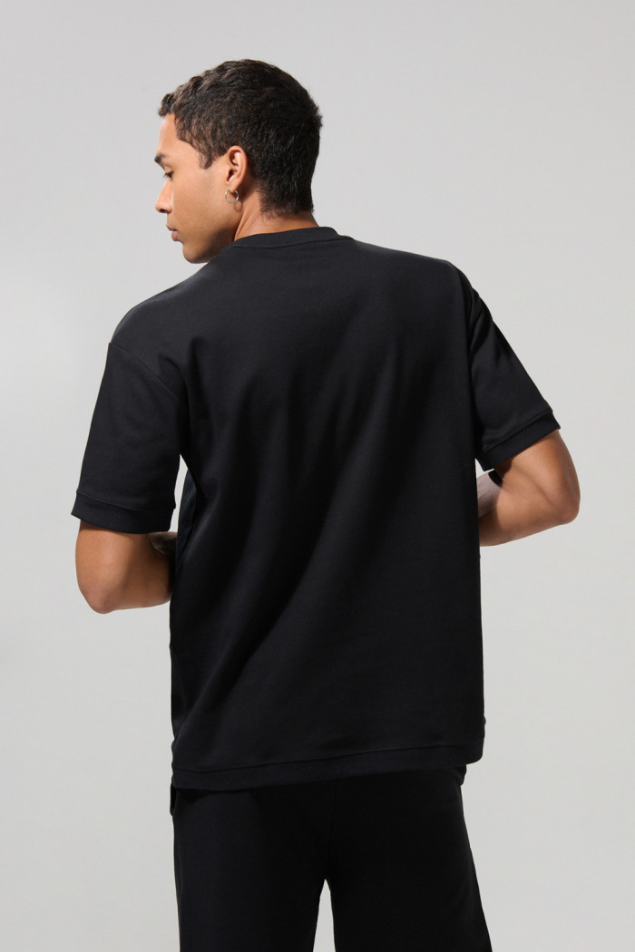 Camiseta oversize en algodón pesado unicolor manga corta