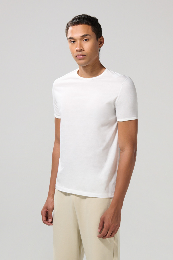 Camiseta unicolor ajustada con cuello redondo y puños en rib
