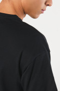 Camiseta en algodón cuello redondo unicolor y hombro rodado