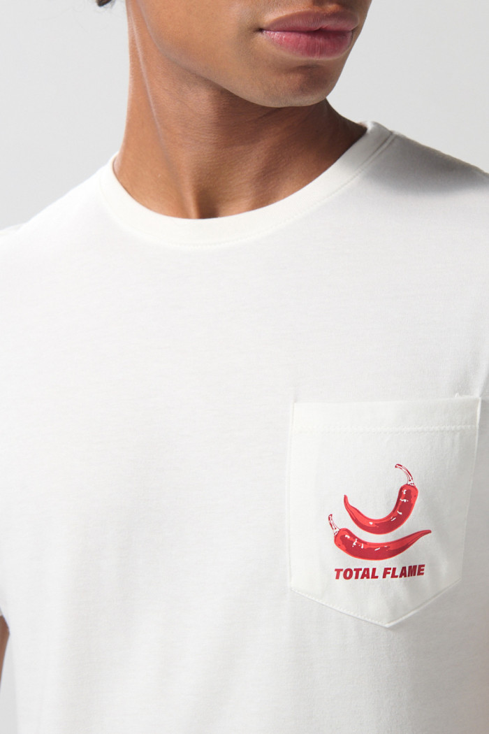 Camiseta en algodón unicolor con manga corta y bolsillo