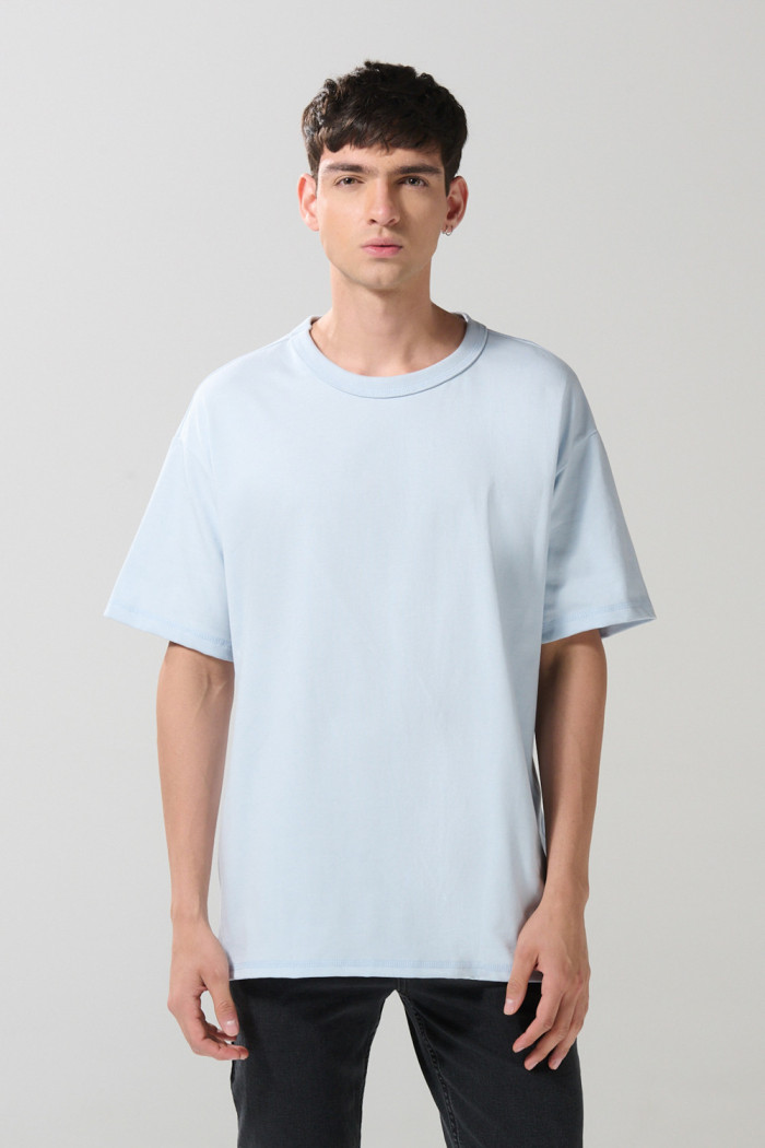 Camiseta oversize unicolor cuello redondo en algodón