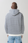 Buzo oversize crema a rayas con capota y bolsillo