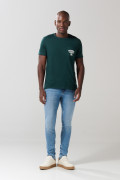 Jean skinny tiro bajo azul claro con ligeros desgastes