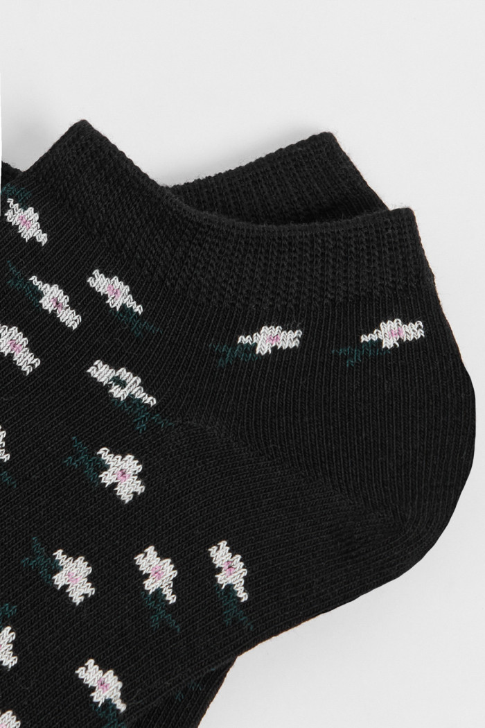 Medias tobilleras unicolores con artes continuos de flores