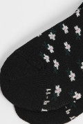 Medias tobilleras unicolores con artes continuos de flores