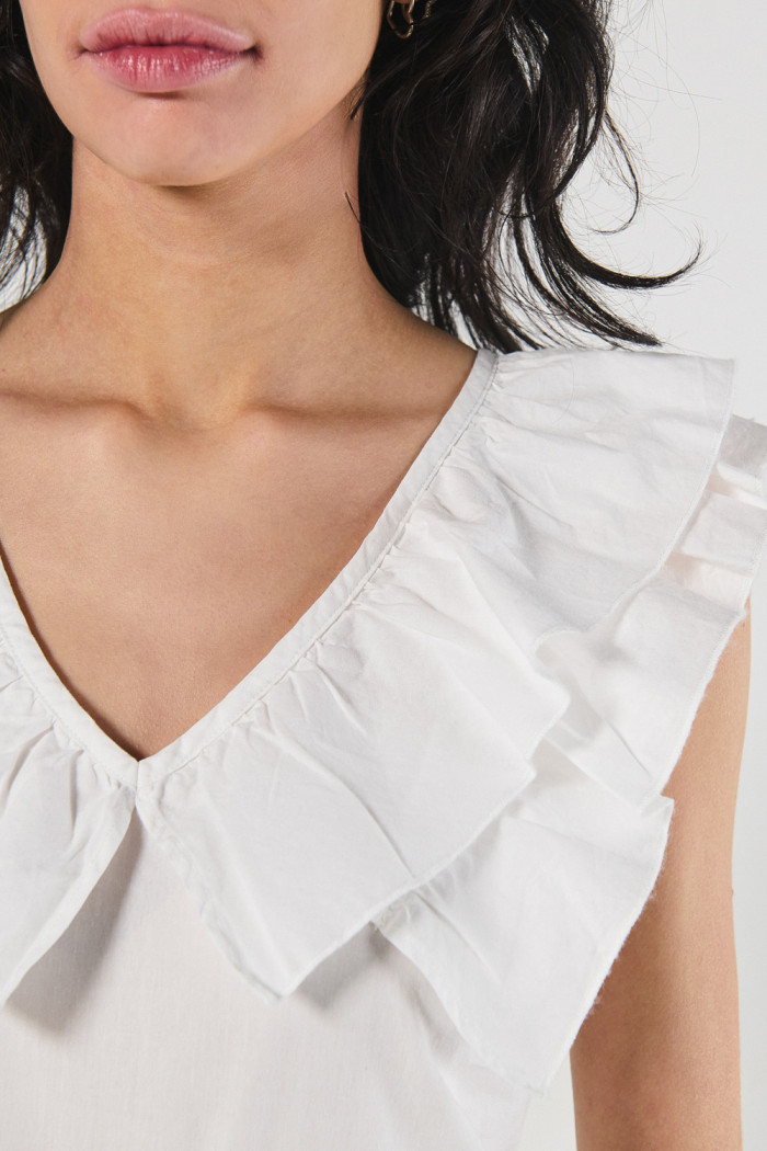 Blusa unicolor en algodón con golas y manga sisa