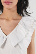 Blusa unicolor en algodón con golas y manga sisa