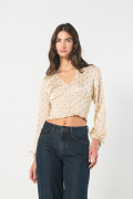 Blusa crop top crema estampada con manga larga y escote V