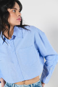 Blusa oversize crop top unicolor con manga larga