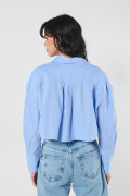 Blusa oversize crop top unicolor con manga larga