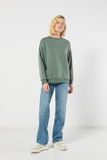 Buzo unicolor cuello redondo oversize con hombro caído