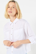 Blusa unicolor con cuello camisero y doble bolsillo en frente