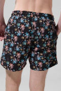 Bermuda negra playera con diseños de palmeras y tiro bajo