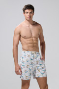 Bermuda crema clara playera con diseños de palmeras