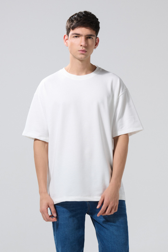 Camiseta unicolor manga corta oversize en tela gruesa