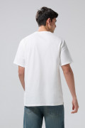 Camiseta oversize unicolor con bolsillo y cuello redondo